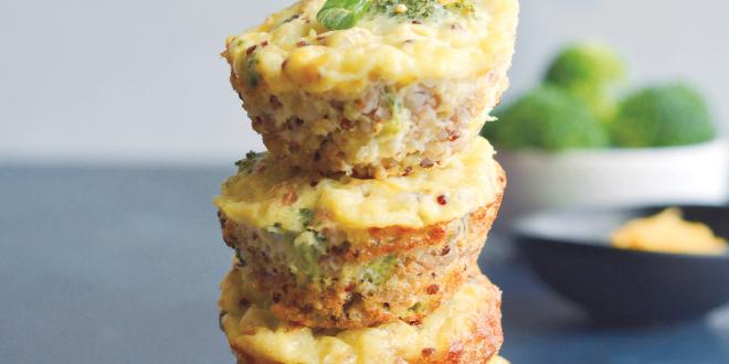 Cheesy Broccoli Quinoa Eggs Muffins stacked like a tower.