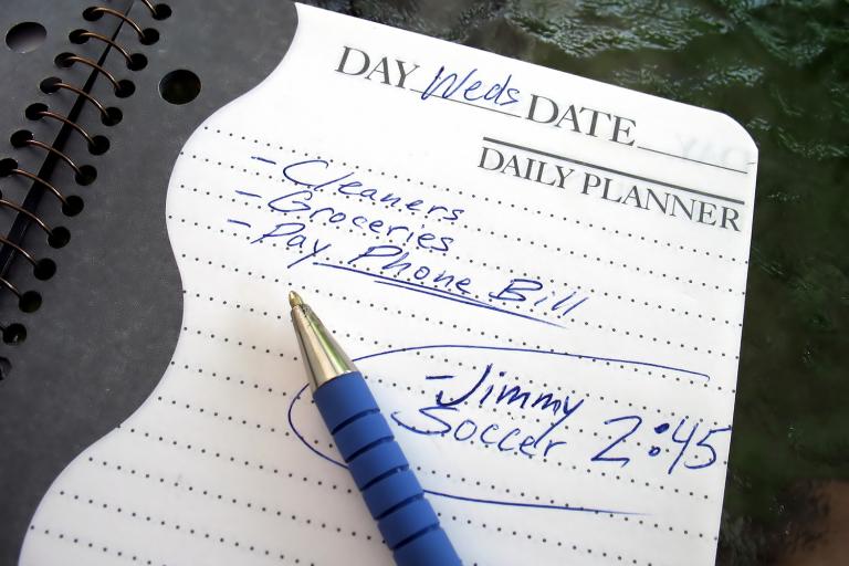 A daily planner filled with chores and notes about kids