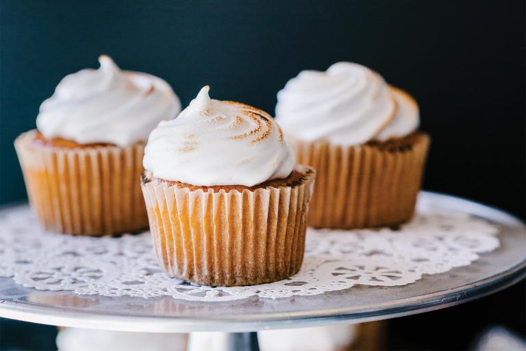 A plate of delicious lemon curd cupcakes with chickpea meringue